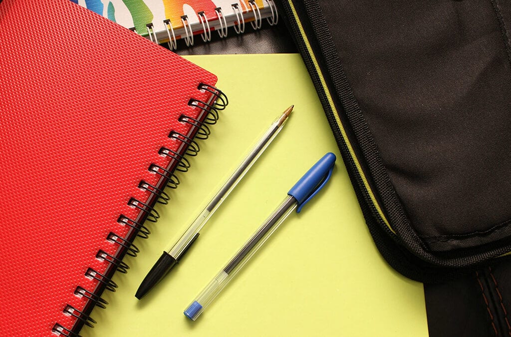 Pens laying on a notebook