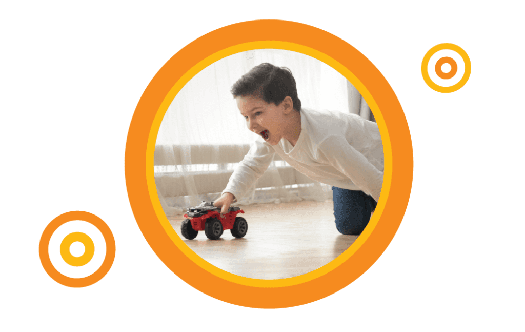 Little boy playing with car