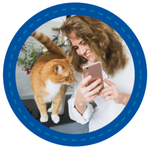 Woman showing cat her phone